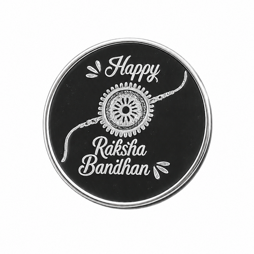 A round black and silver Rakhi Bandhan sticker or decal featuring a white embroidered-style design with the text 'Happy Raksha Bandhan' and a central decorative motif, shown on a plain white background.